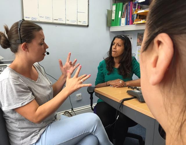 JDA interpreter signing telephone call to deaf support worker and client 