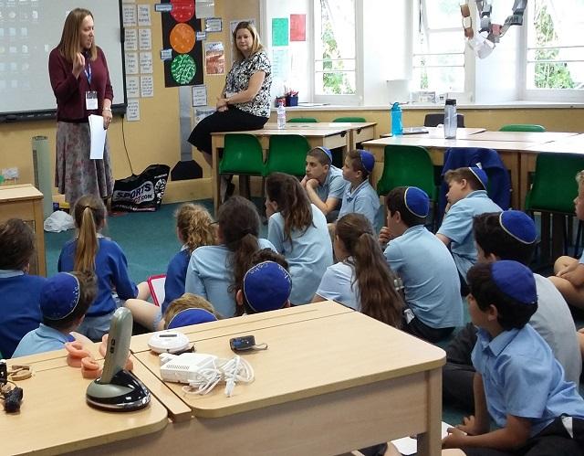 School children being taught deaf awareness training in schools 